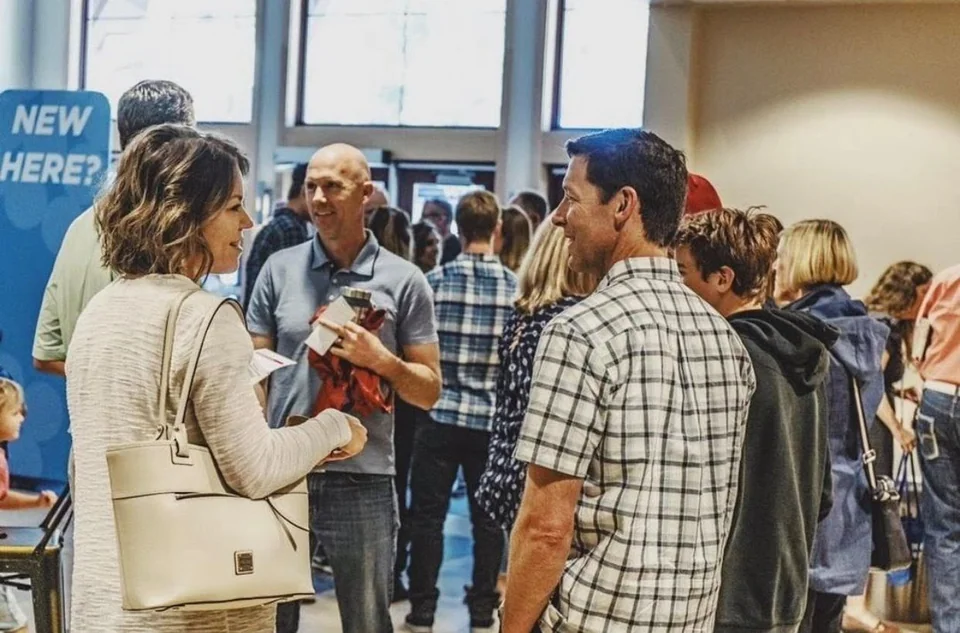 People greeting each other at church